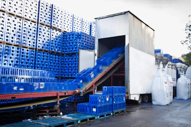 Recycling facility where blue plastic crates are transferred